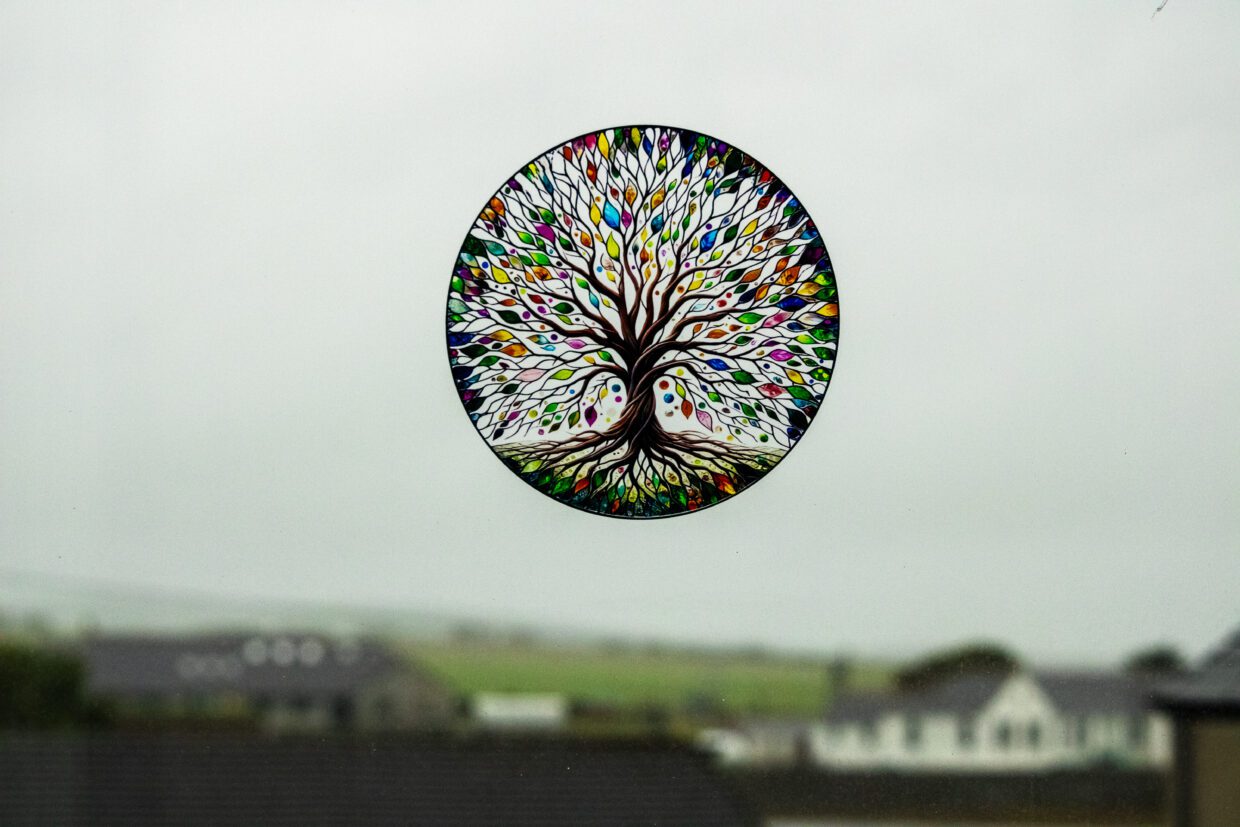 A colourful tree motif in our window